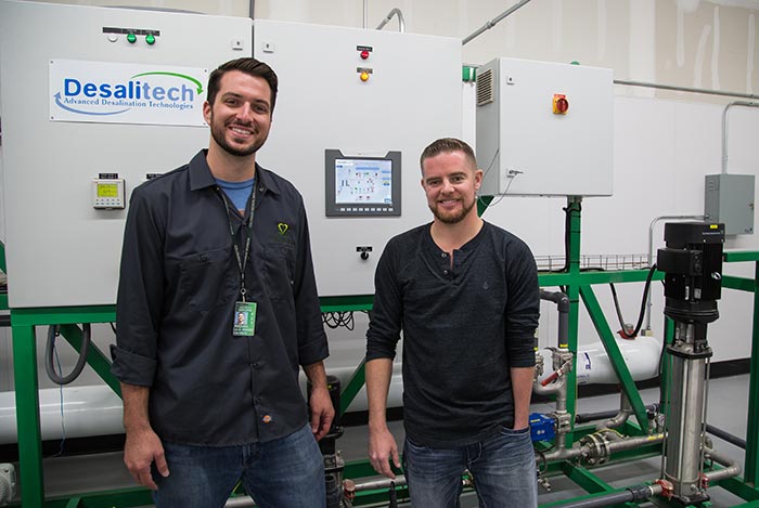 Michael Williamson, '07 (left), purchased a water treatment system from his best friend, Michael Boyd, '05,  to save and reuse water in his company's new 80,000-square-foot, hydroponic, medical marijuana cultivation center.