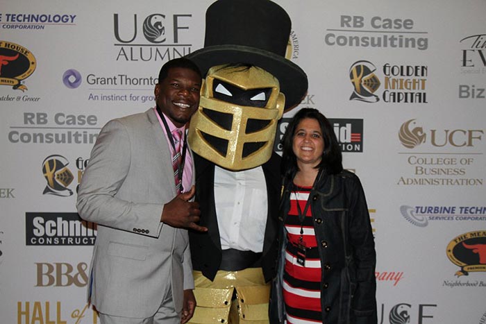 A formally dressed Knightro posed on the red carpet with his buddies, "24K" Kevin Smith, former Knights' running back, and Jessica Reo, senior associate athletics director.