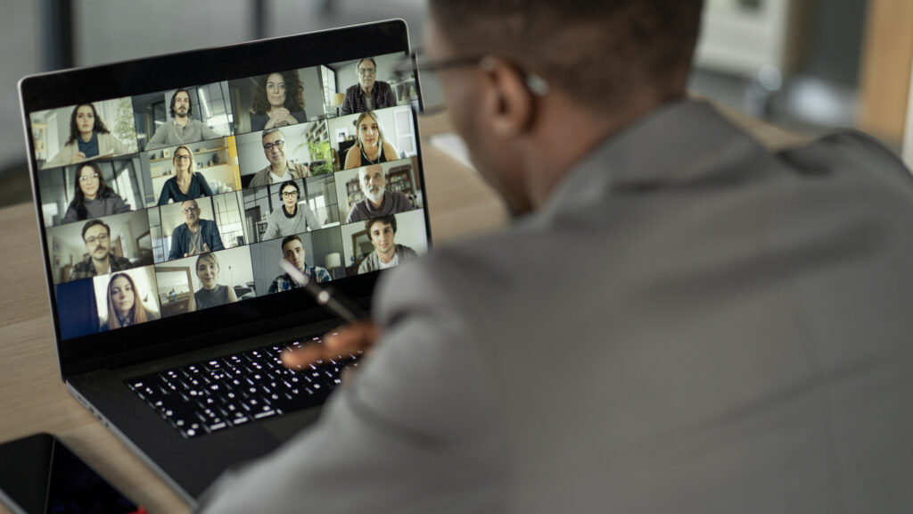 Image of person on a virtual call on a laptop