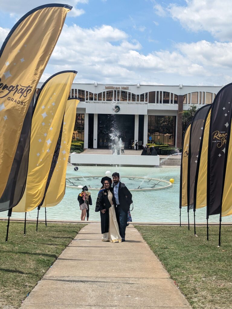 couple in front of ucf reflecting pond
