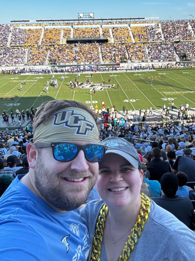 man and woman at ucf football game