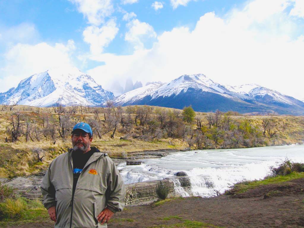 man in front of mountains