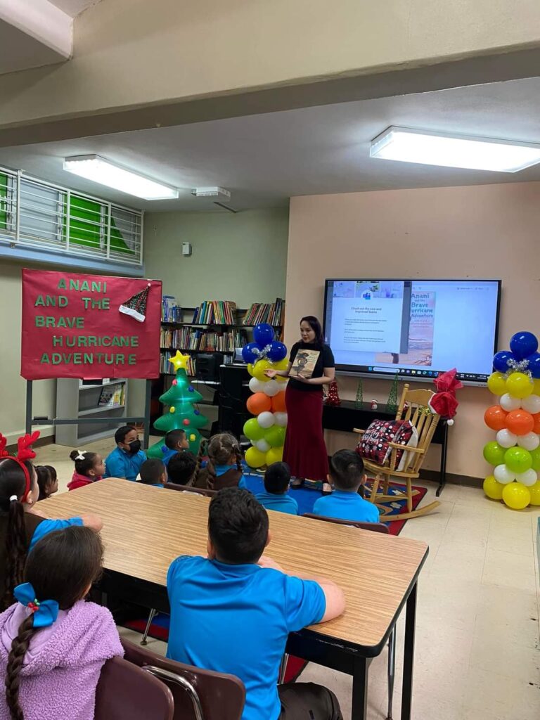 woman reading a book to children