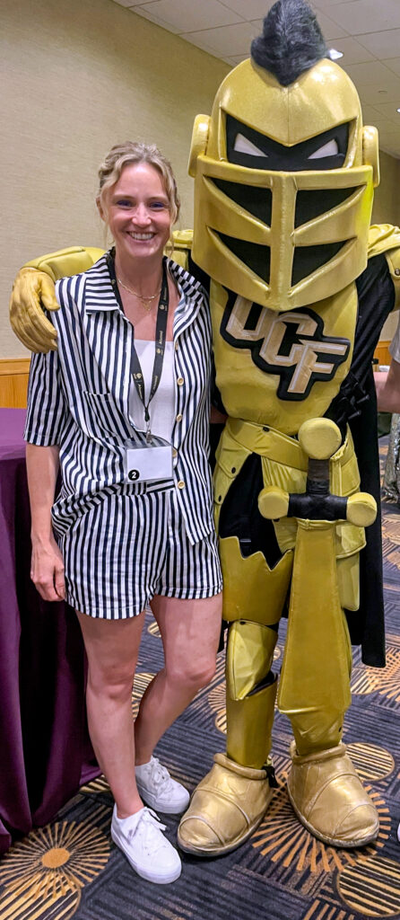 woman standing with Knightro