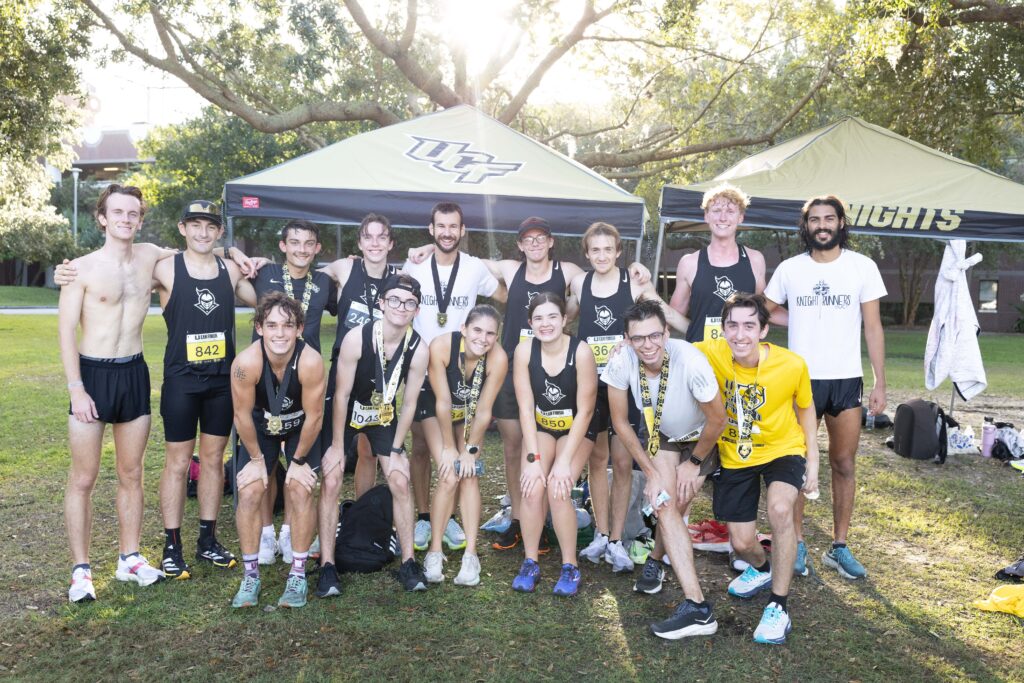 group of runners posing after a race