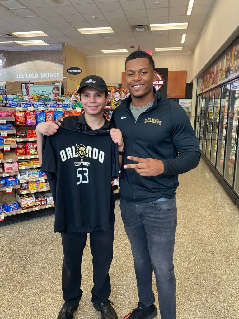 two young men standing in a convenience store