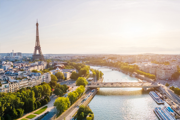 image of the Eiffel Tower on the banks of the Seine River