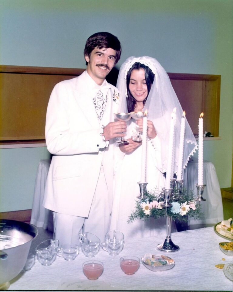 man and woman in wedding attire