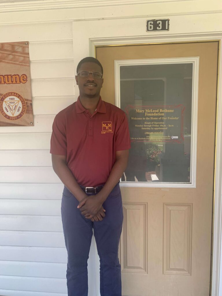 man standing in front of a door.