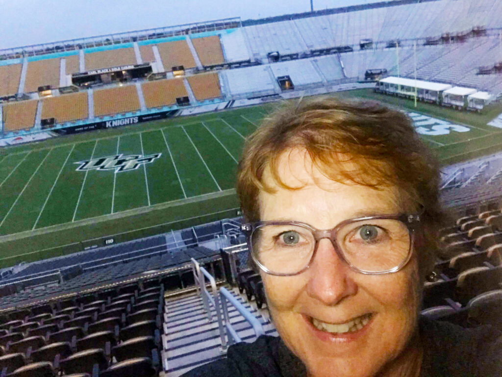 JS-UCF-stadium - UCF Alumni woman at empty football stadium