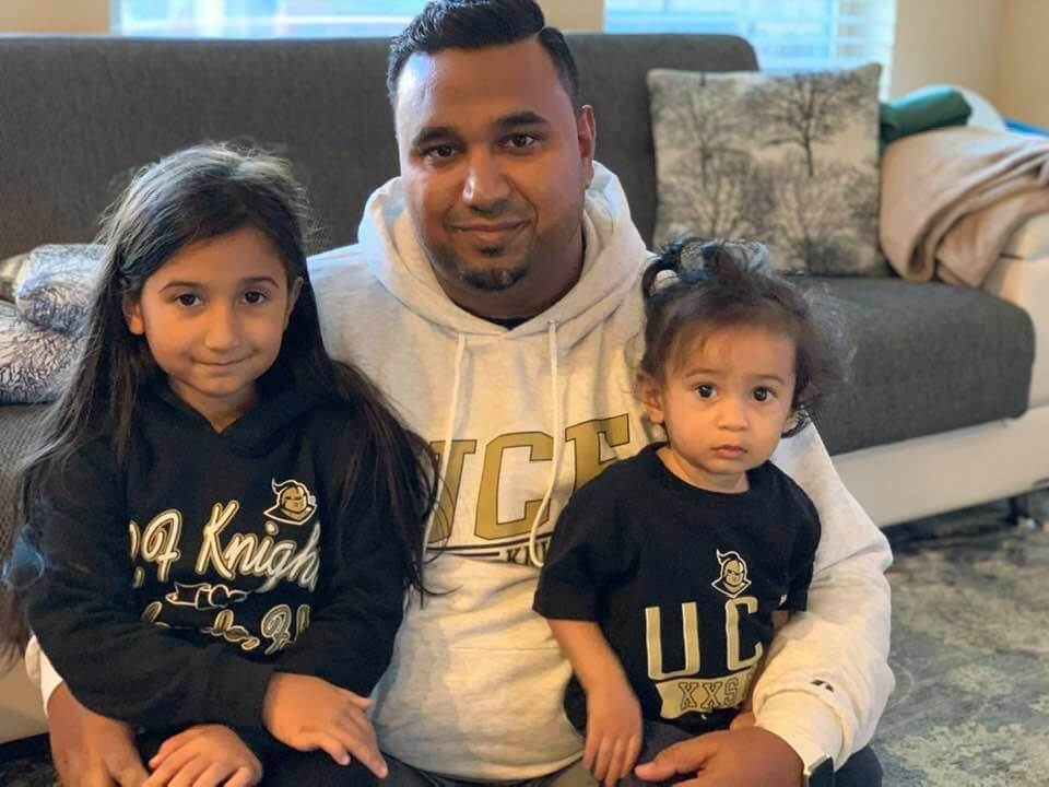 AJ and his daughters get ready for football.