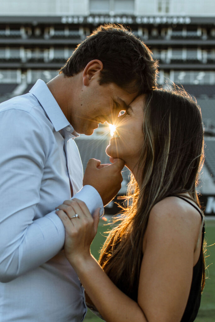 man and woman with sunset behind them