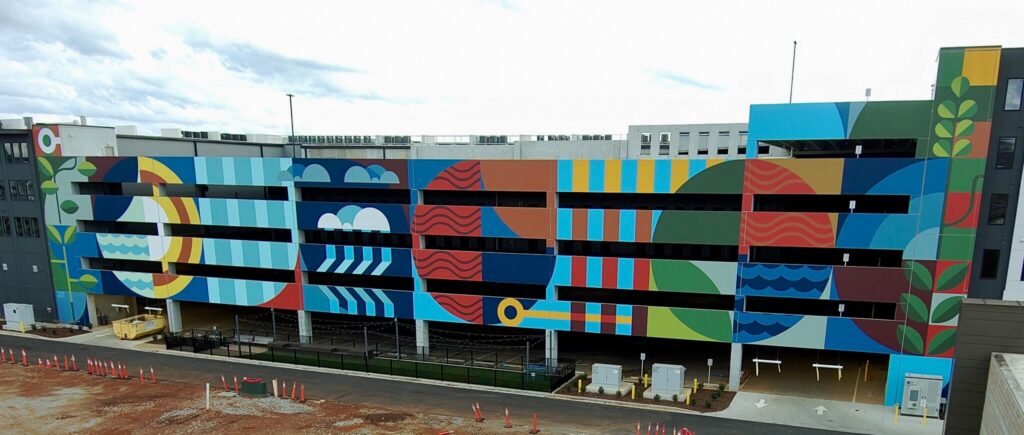 parking garage exterior painted in mural