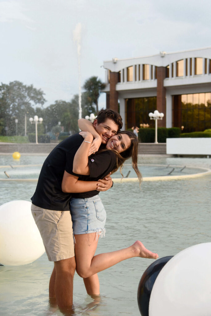 man and woman in fountain