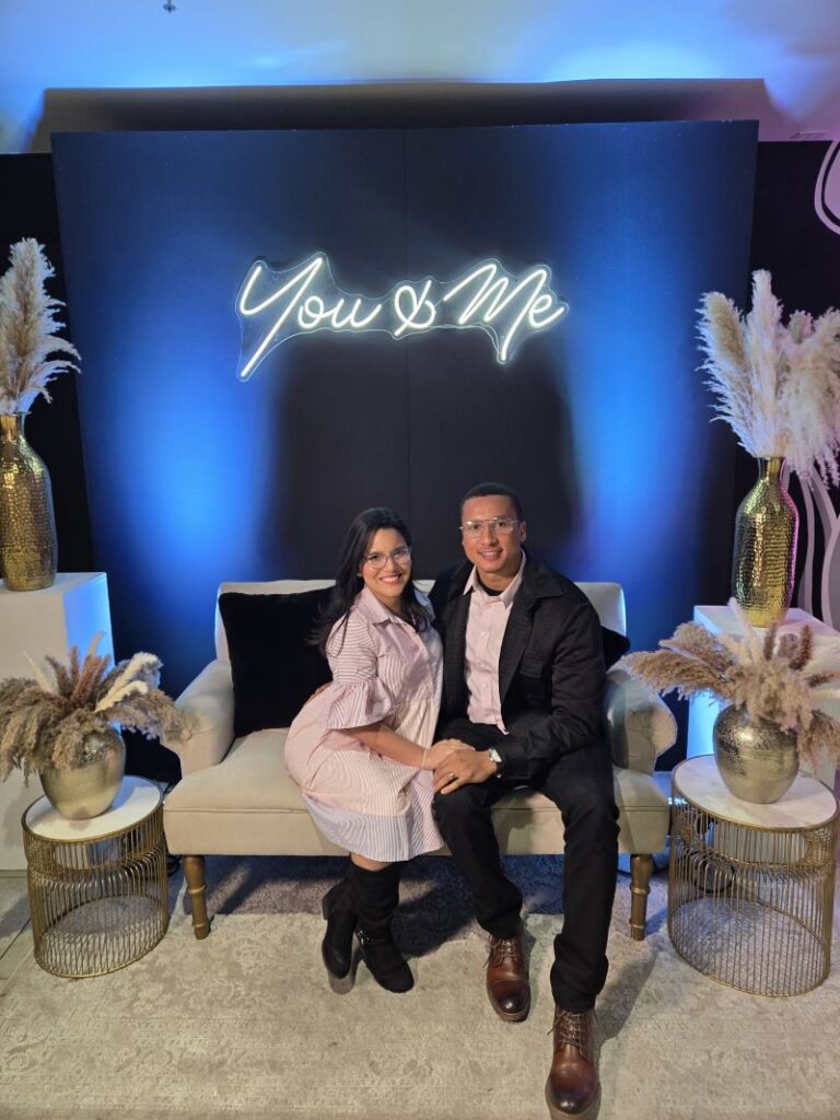 man and woman sitting on sofa