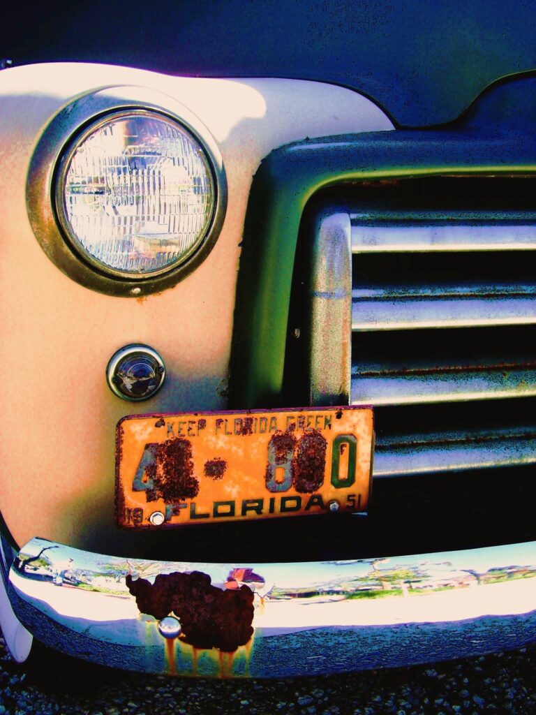 Keep FL Green - UCF Alumni a classic car with rusty license plate