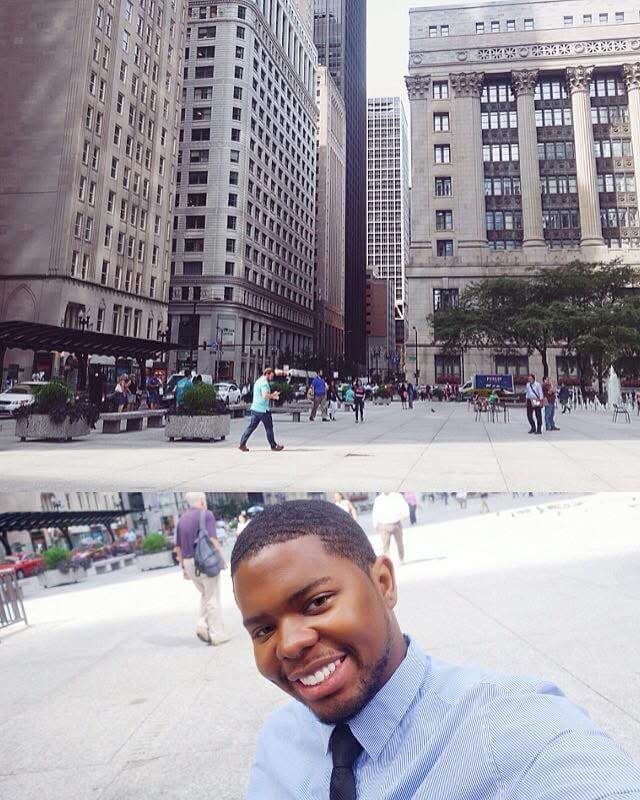 man standing in front of Deloitte headquarters