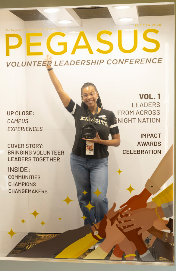 Smiling woman posing with an award in front of a Pegasus Volunteer Leadership Conference backdrop (Summer 2026).