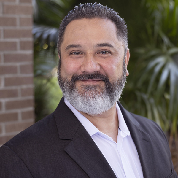 headshot of Eric Sly