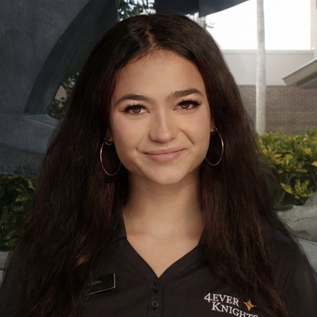 Portrait of a smiling woman with long dark hair wearing a black uniform with a 4EVER KNIGHTS logo.