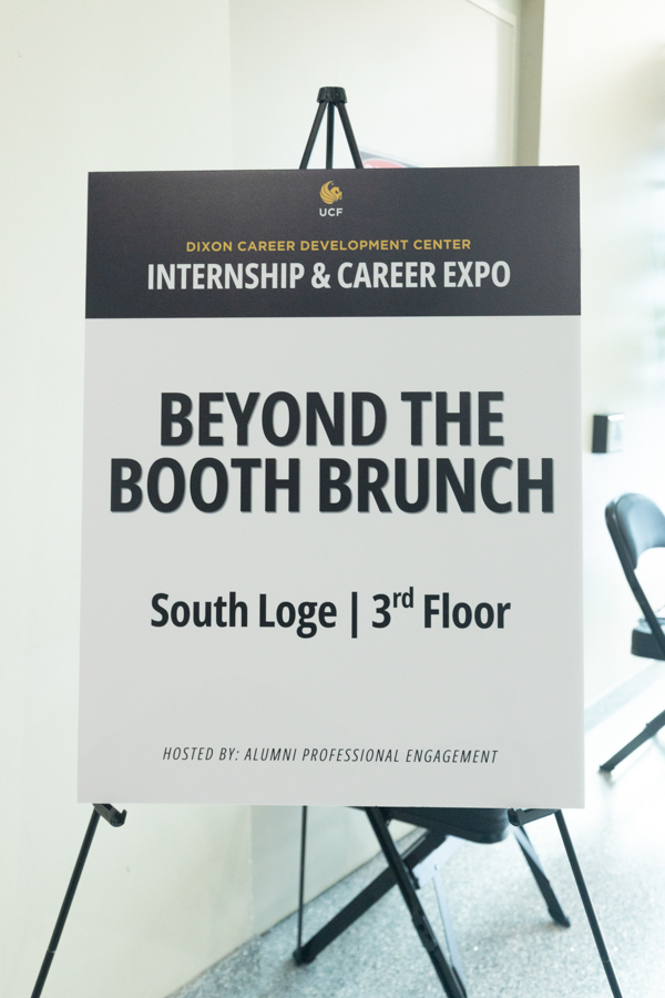 Signboard advertising the UCF Internship & Career Expo: 'Beyond the Booth Brunch' on South Loge, 3rd Floor (Hosted by Alumni Professional Engagement).