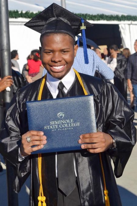 man holding diploma